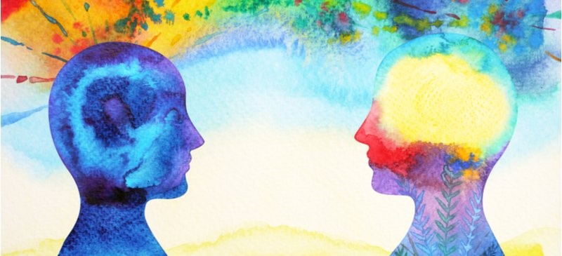 Watercolour illustration of two silhouetted heads facing each other with colourful abstract patterns rising above them